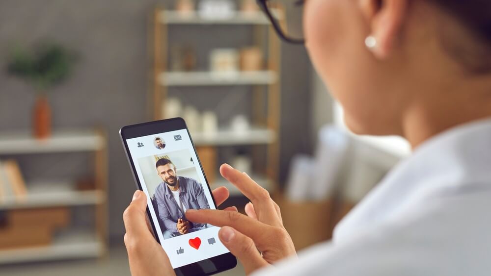 woman matching with a handsome man on a dating app