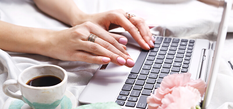 Online dating. A woman writes on the computer