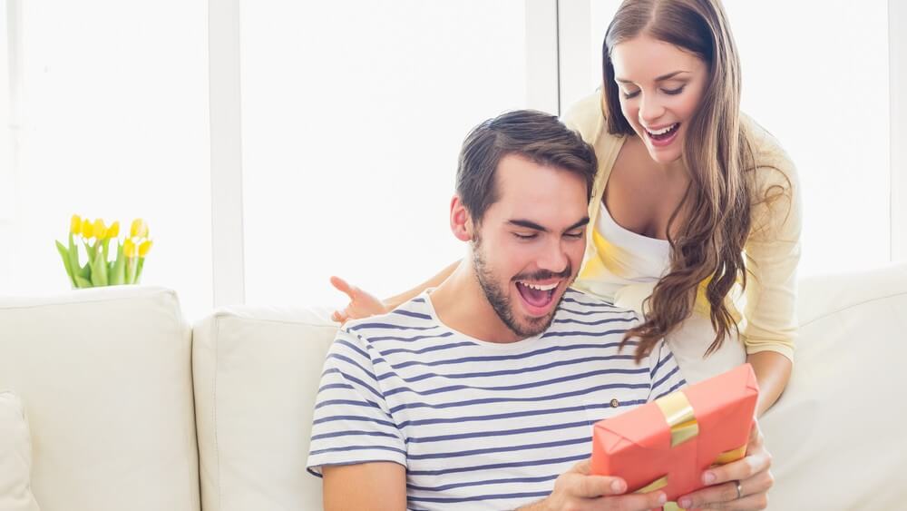 Man surprised after receiving red gift box from girlfriend